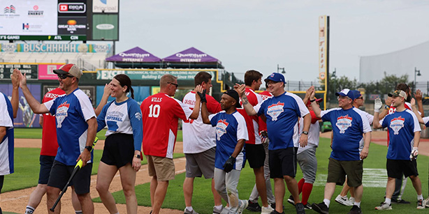 Two teams giving each other high fives